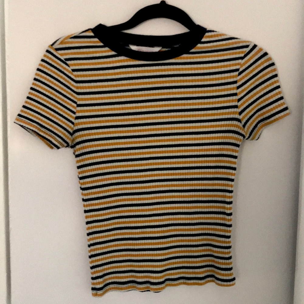 white, yellow, and dark blue striped shirt.